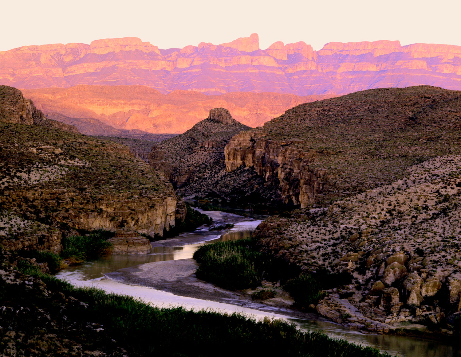 Rio Grande River with Sierra del Carmen mountains in the background at sunset