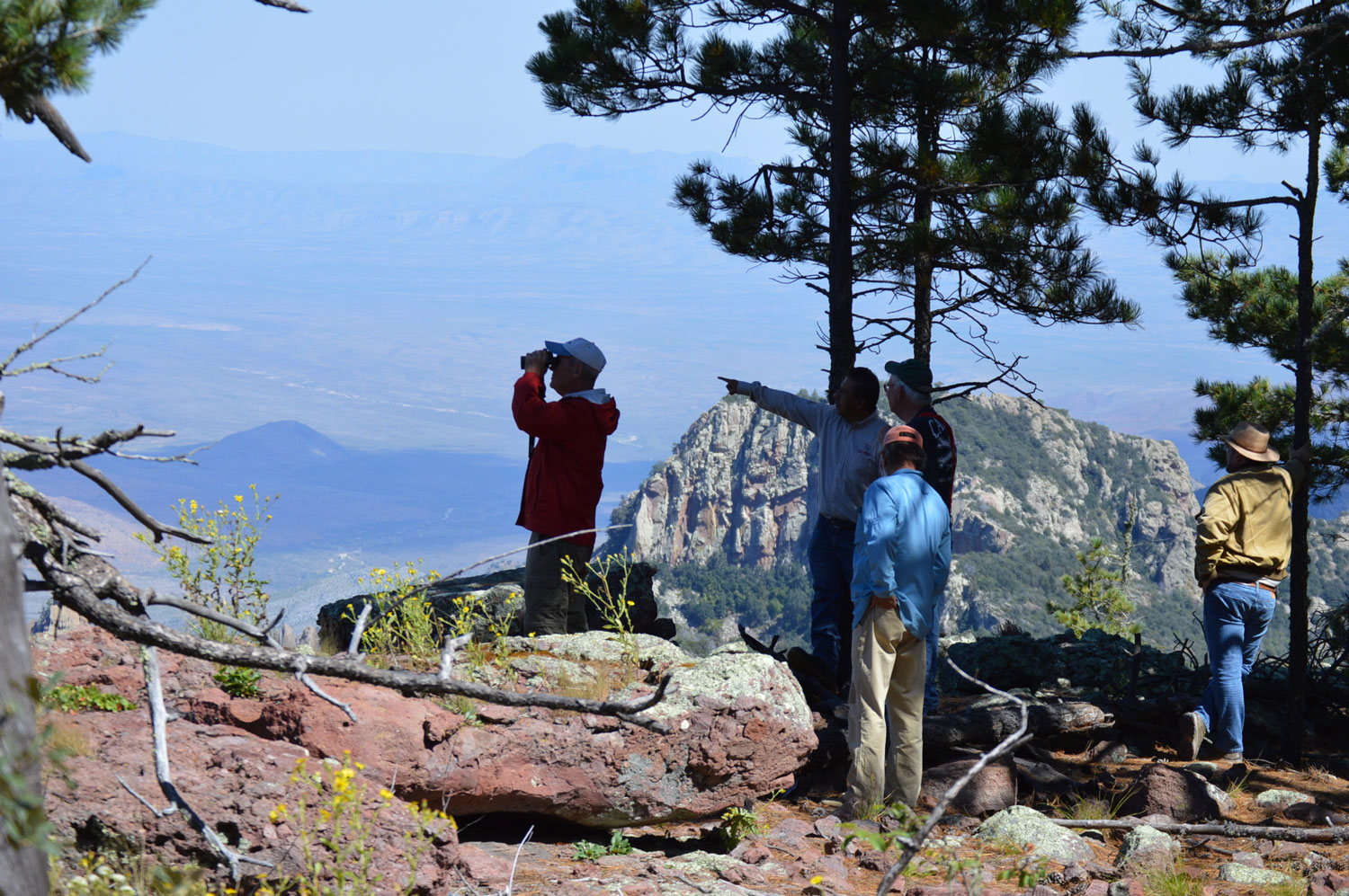 Guests and guides standing on high overlook on Mesa Bonita at 8,600 feet elevation