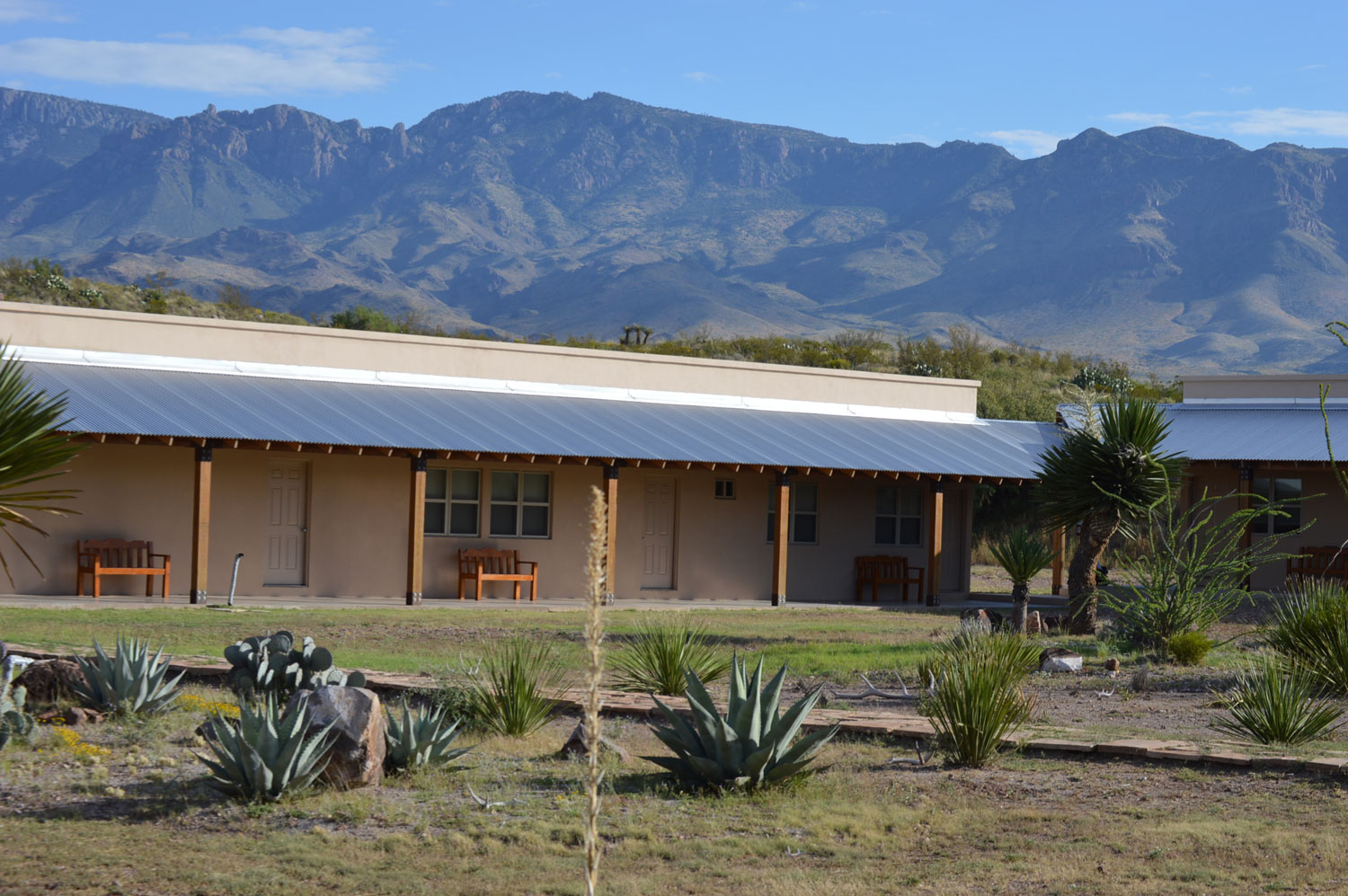 Rustic accommodations at Pilares with mountains in the background